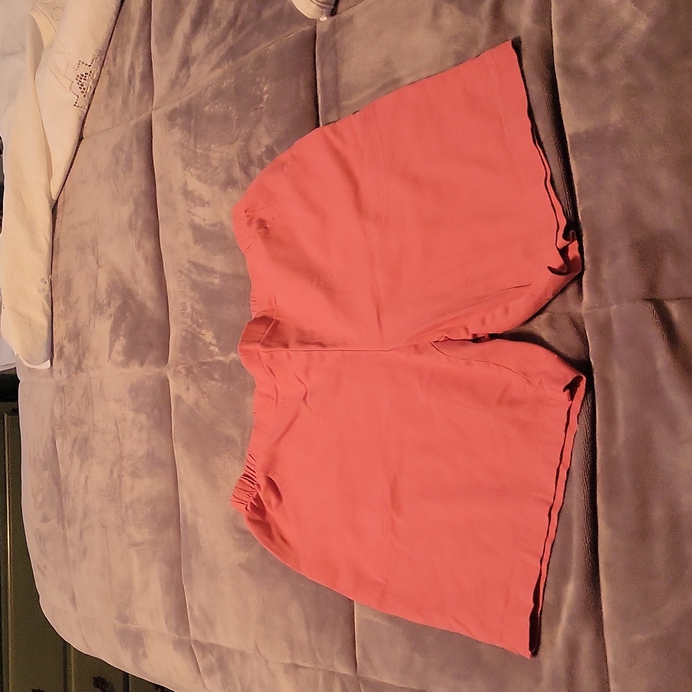 Peach color shorts. 2 deep front pockets.